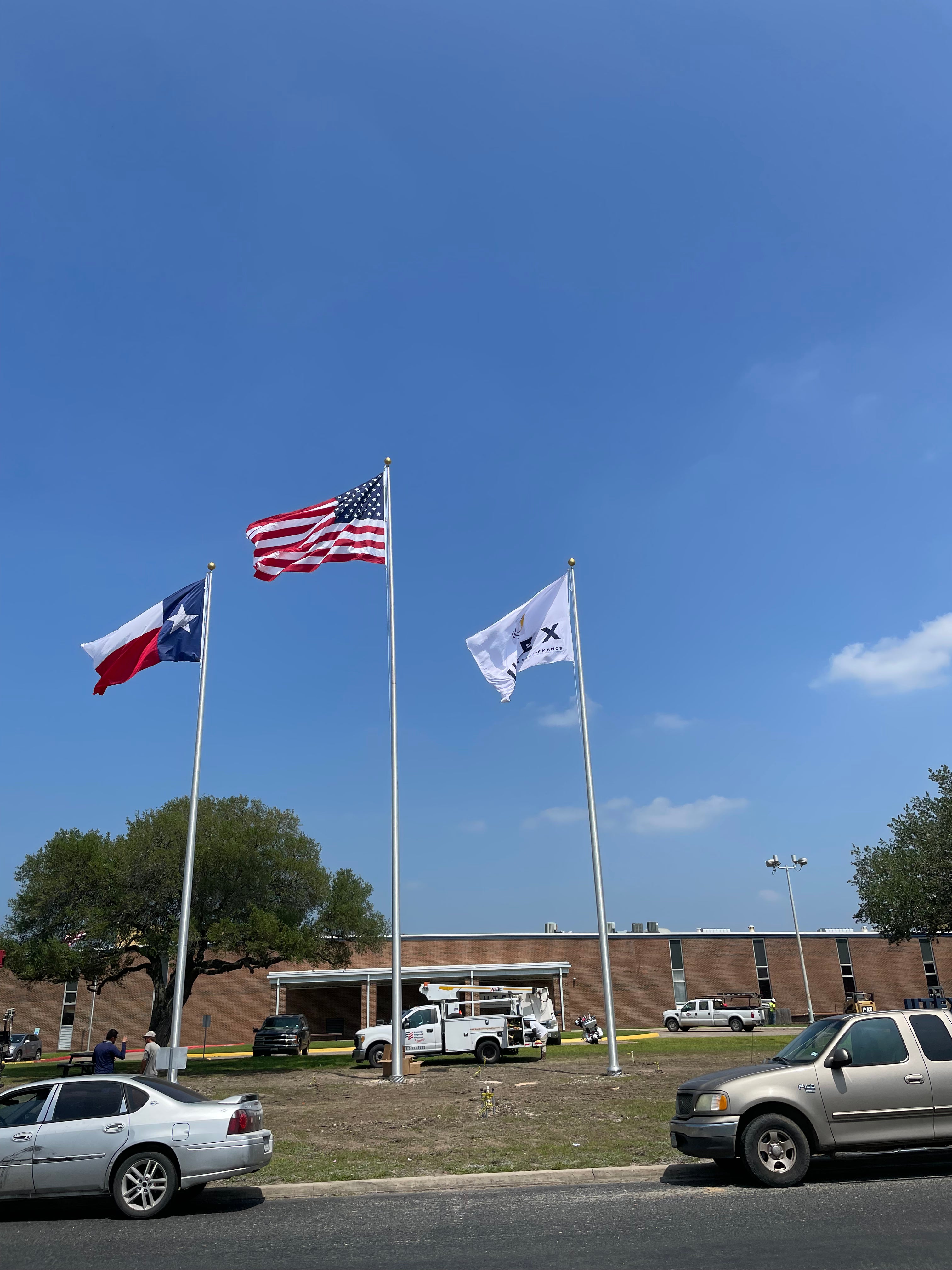1-60'/2-50' Satin finish. Flying 12'x18' U.S., 10'x15' Texas and Corporate flags.